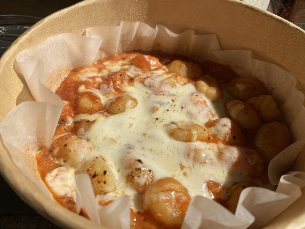 Gnocchi with cheese and tomato sauce.